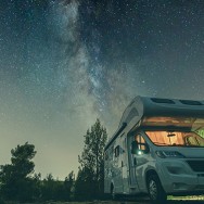 campervan caravan vehicle for van life holiday on mobile home camper mobile motor home RV campervan for an outdoor nomad lifestyle camper van journey camping in the parking space night sky with stars